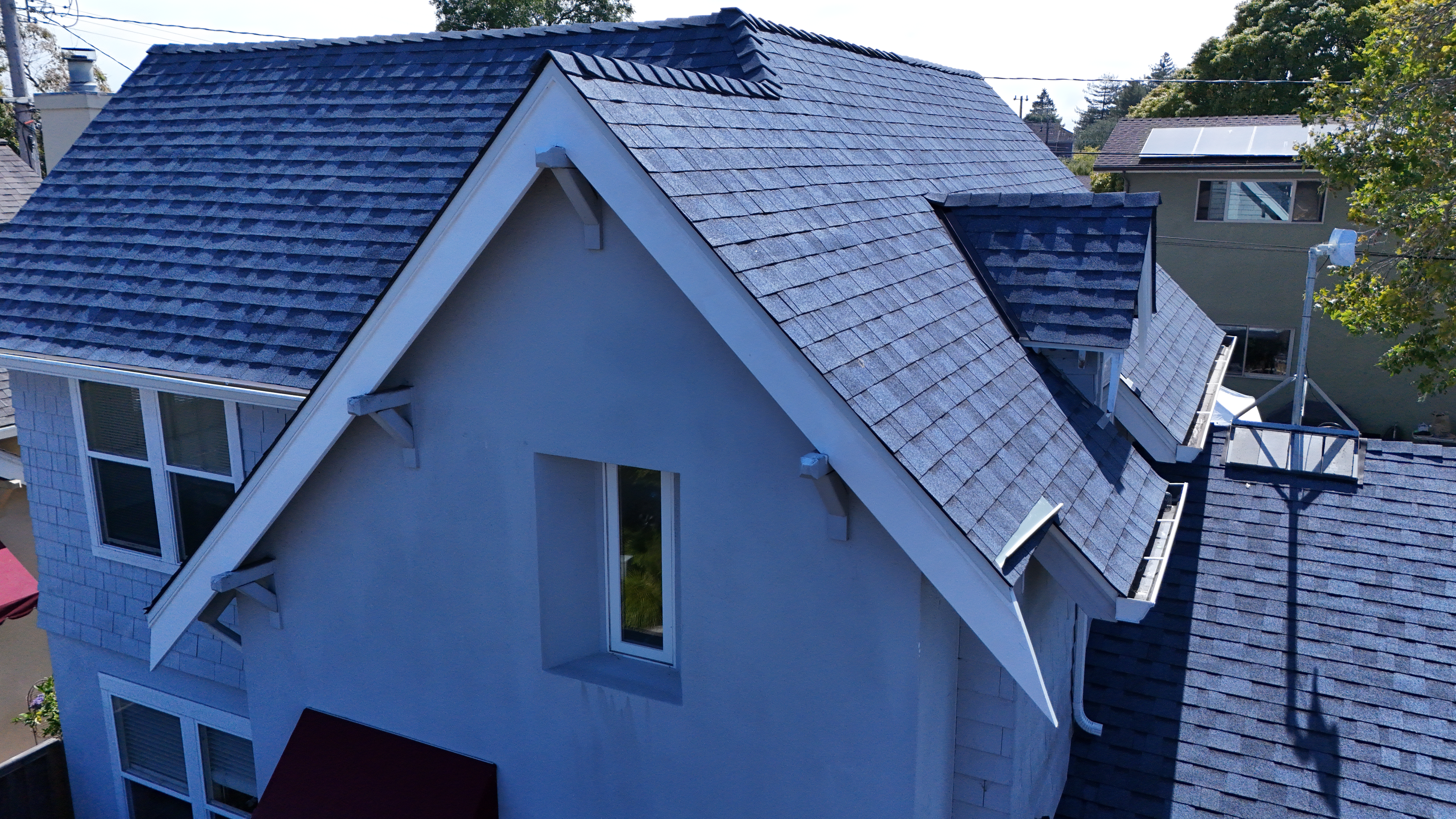 Close-up aerial of Harbor Blue Duration shingles at gable peak